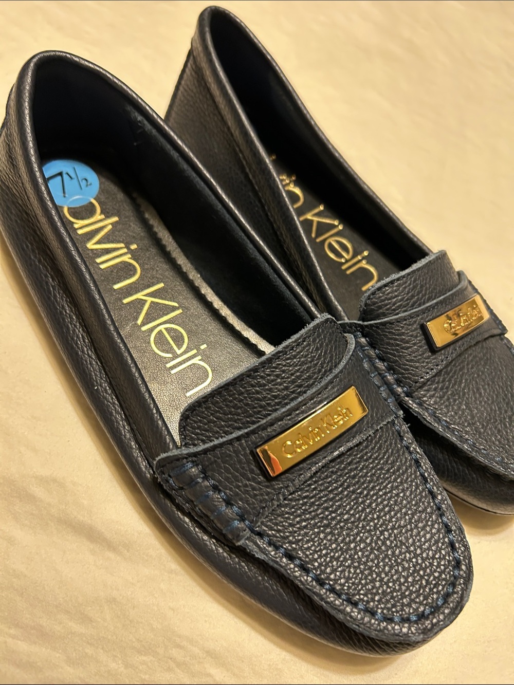 Calvin Klein Women's Navy Leather Moccasin Loafers with Gold Plaque